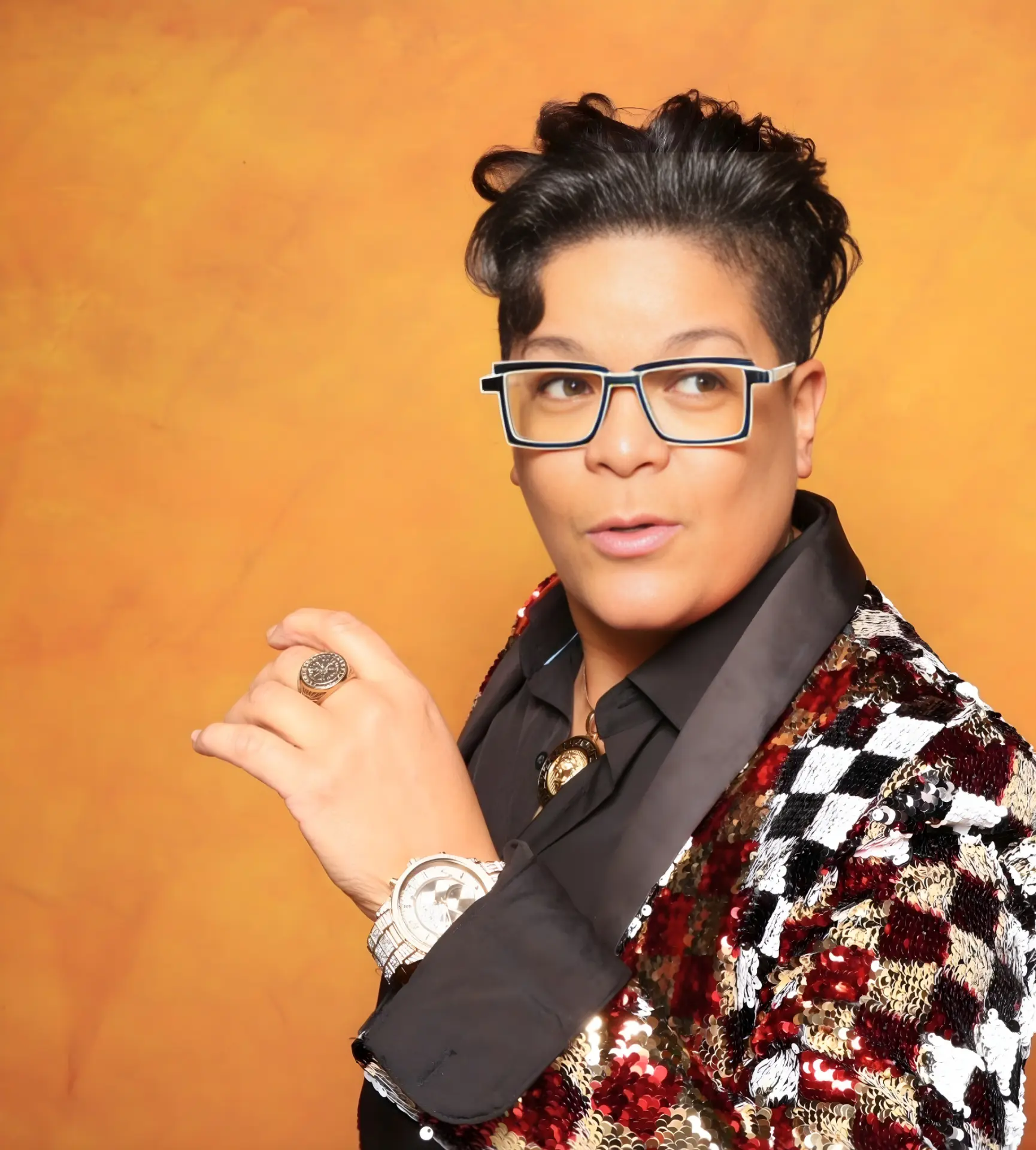 Brooklyn Dicent, professional comedian and party entertainer, in a sequined jacket